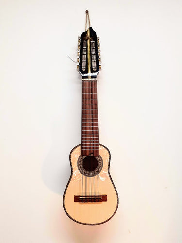 Charango is a 5 double string instrument. Its origin can be found in Peru and Bolivia.  It has become a common instrument that is played through out the Andes.