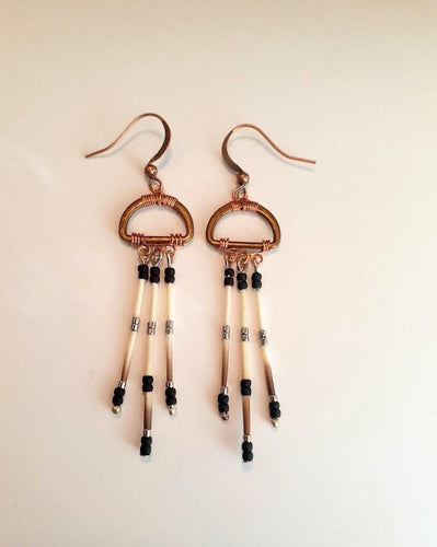 Brass oval shape with copper wire wrap. Porcupine quill earrings