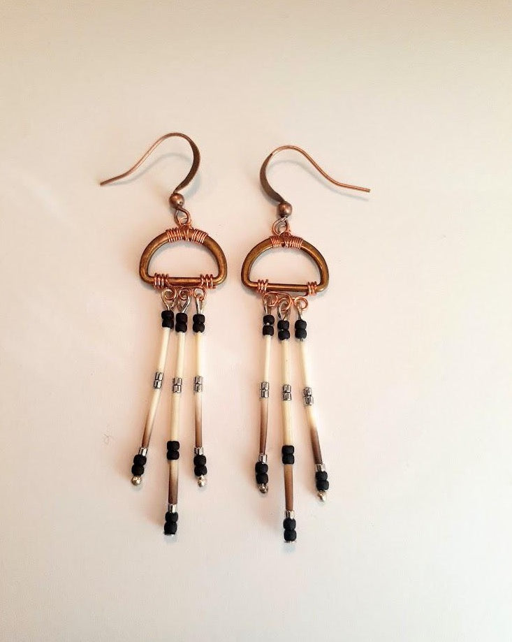 Brass oval shape with copper wire wrap. Porcupine quill earrings