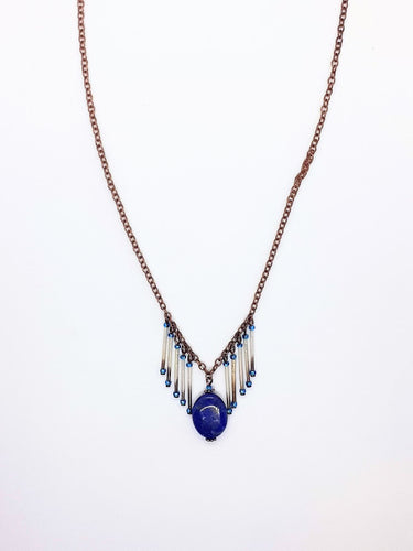 One of a kind. Lapis Lazuli stone with 10 strand porcupine quills. Approximately 21  inch long copper necklace