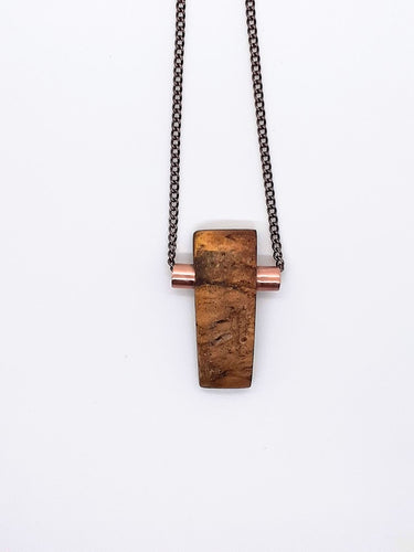 One of a kind. Aromatic Palo Santo wood necklace rectangle carved piece with copper tubing inlay.