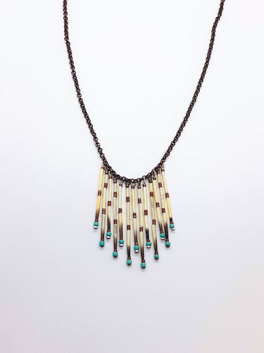 Turquoise & copper beads with 13 strand porcupine quills on a 21 inch copper necklace chain.